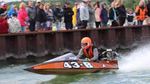 Black and orange runabout racing