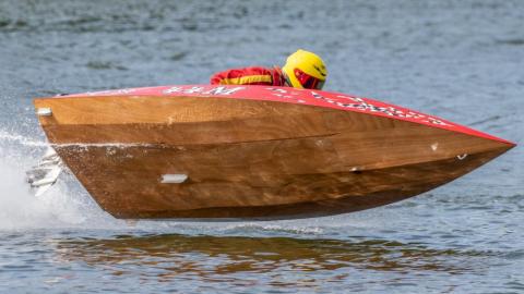 Red runabout catching some air